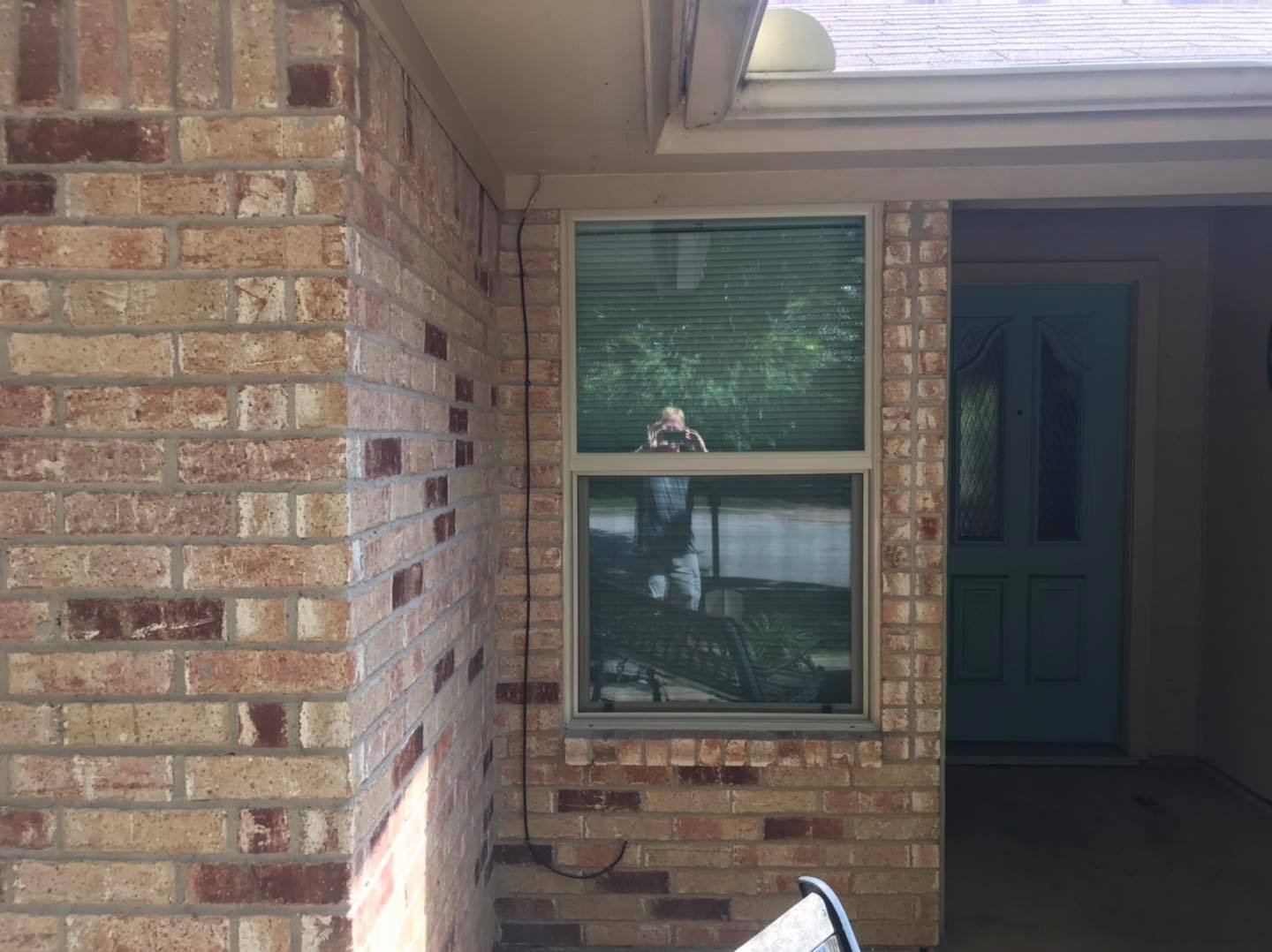 Newly installed double-hung windows on a residential property
