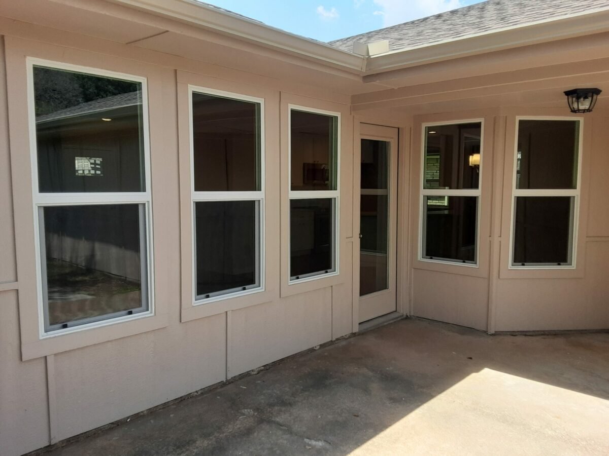 Replacement windows installed on a house on a sunny day