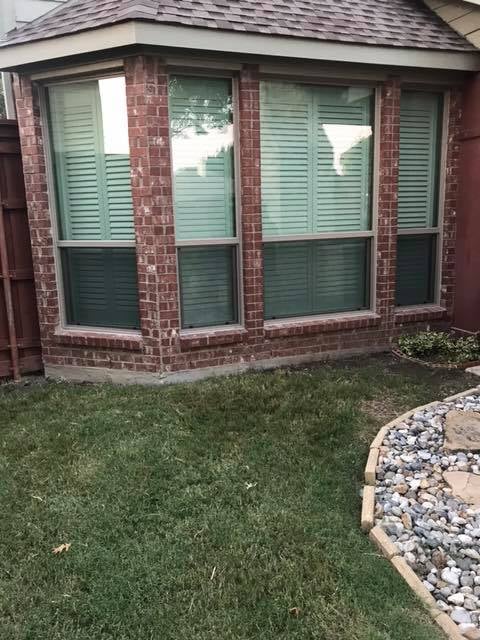 Window installation in progress on a residential property