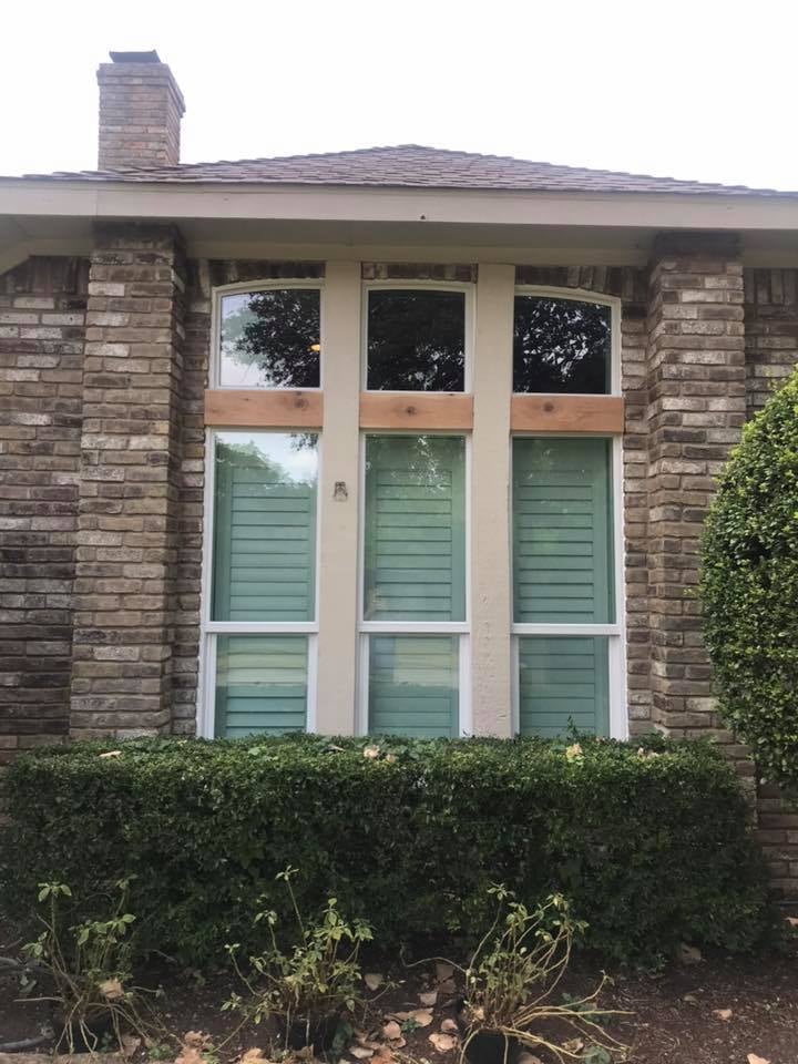 Finished replacement window installation on a house exterior